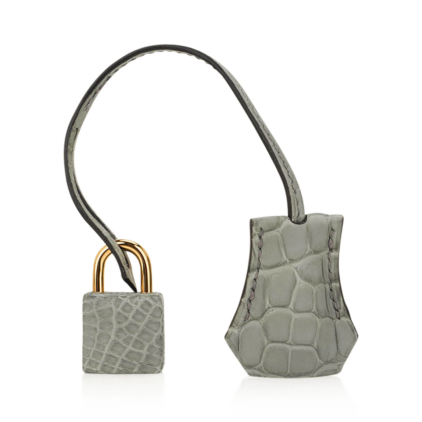 Muted Soft Concrete Grey Embossed Scaled Sharp Edged Compact Hand Tote With Luminous Golden Twist Lock Hardware And Matching Grey Suspended Metal Padlock Charm